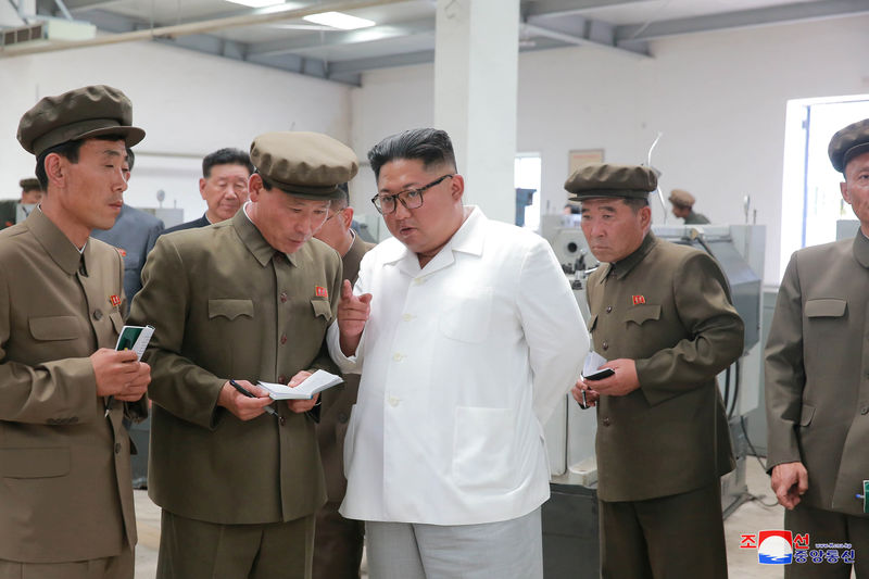 © Reuters. FILE PHOTO - North Korean leader Kim Jong Un gives field guidance during his visit to a machine factory under the Ranam Coal Mining Machine Complex