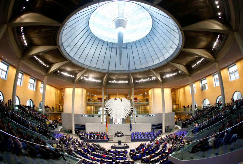 © Reuters. FILE PHOTO: German Chancellor Angela Merkel addresses the lower house of parliament Bundestag in Berlin