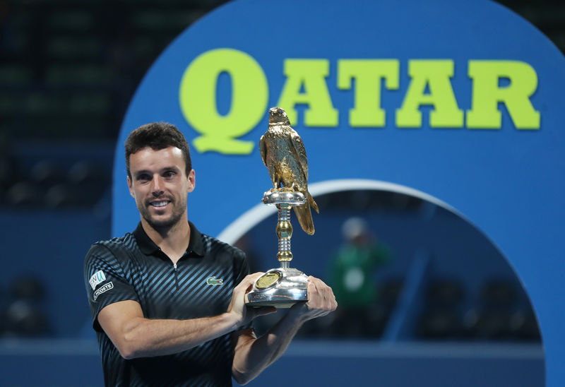 © Reuters. باوتيستا أجوت يحرز لقب بطولة قطر المفتوحة بفوز على برديتش