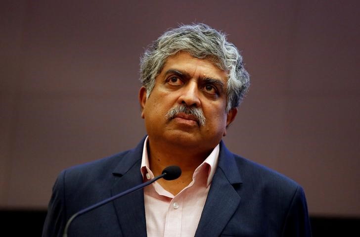 © Reuters. Nandan Nilekani, Co-founder and Non-Executive Chairman of Infosys listens to reporters' questions during the announcement of the company's quarterly results at its headquarters in Bengaluru