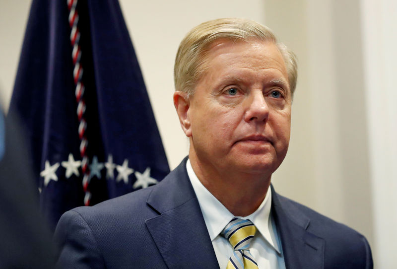 © Reuters. FILE PHOTO: Sen. Lindsey Graham (R-SC) waits for U.S. President Donald Trump to enter the room to speak about the "First Step Act" in the Roosevelt Room at the White House in Washington, U.S.