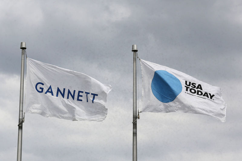© Reuters. FILE PHOTO: The corporate flags for the Gannett Co and its flagship newspaper, USA Today, outside headquarters in McLean, Virginia