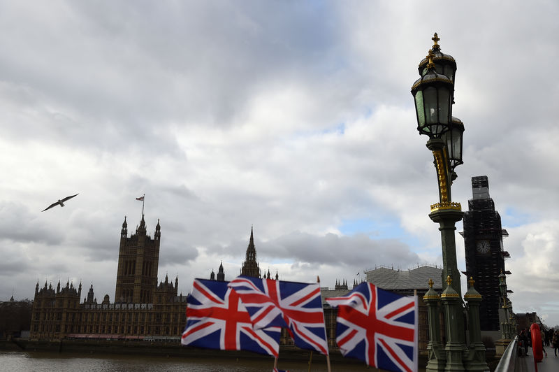 © Reuters. Union Jack flags are seen for sale outside the Houses of Parliament in London