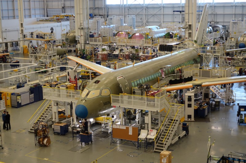 © Reuters. An Airbus A220 passenger jet stands in the final assembly line, where the European company plans a $30 million investment to keep up with forecast demand