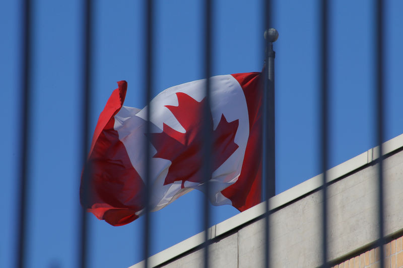 © Reuters. The Canadian national flag flies above the Canadian embassy in Beijing