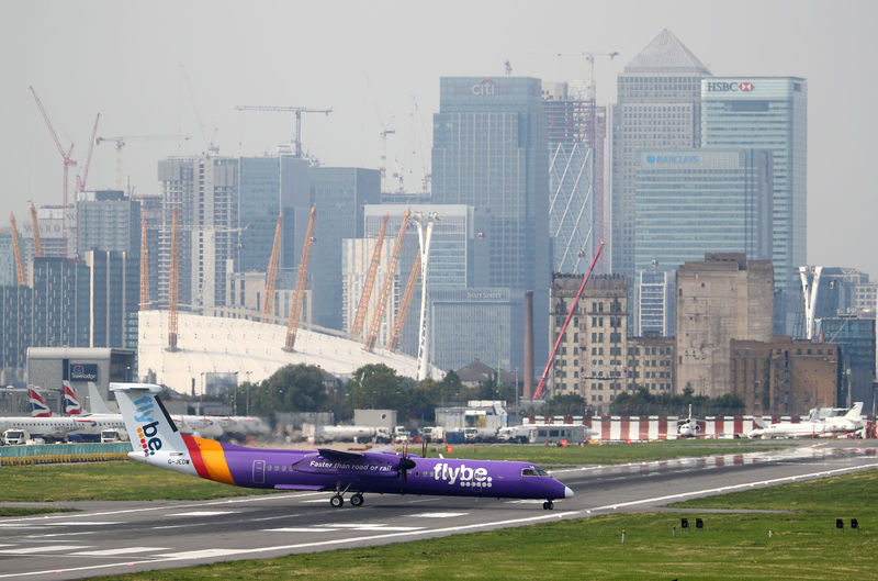 © Reuters. FILE PHOTO: A Flybe Bombardier Dash 8 Q400 airplane taxis at City Airport in London