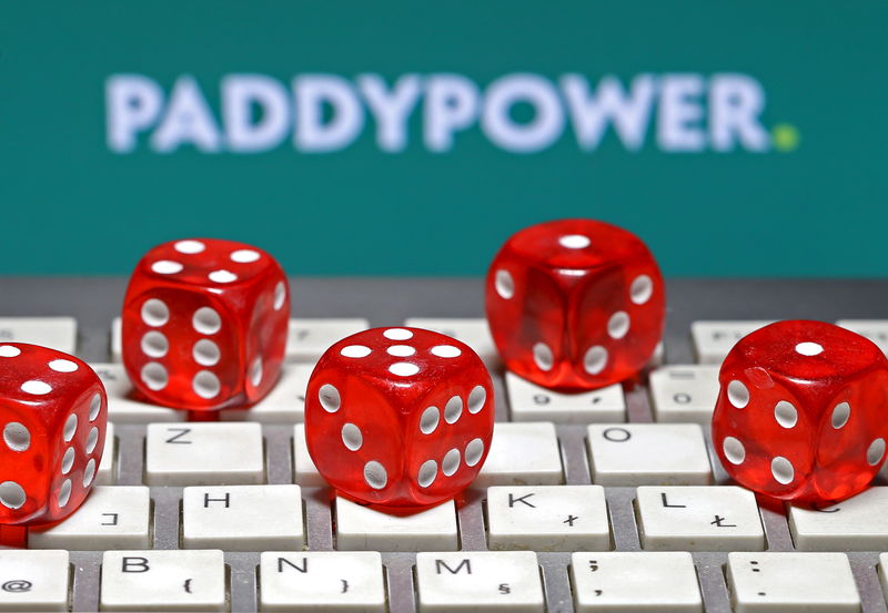 © Reuters. Paddy Power logo is seen behind a keyboard and gambling dice in this illustration taken in Sarajevo