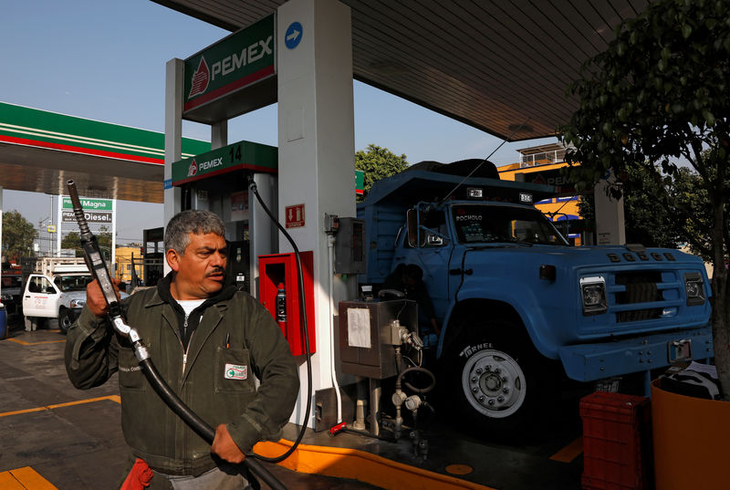 © Reuters. An employee is seen after filling a truck with fuel diesel at a gas station, in Mexico City