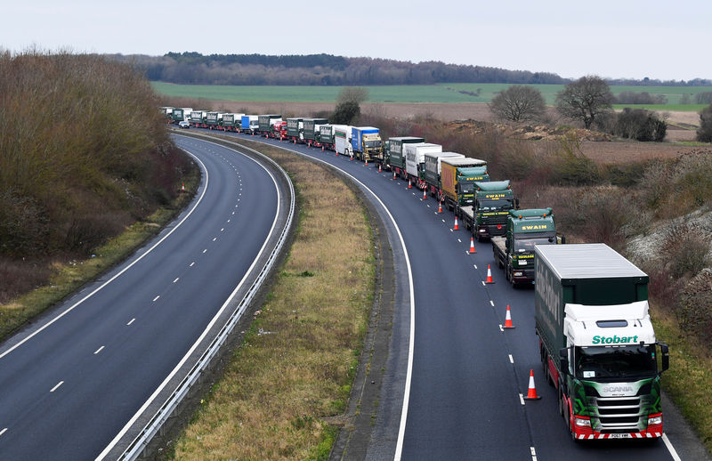 © Reuters. A line of lorries is seen during a trial between disused Manston Airport and the Port of Dover of how road will cope in case of a "no-deal" Brexit, Kent