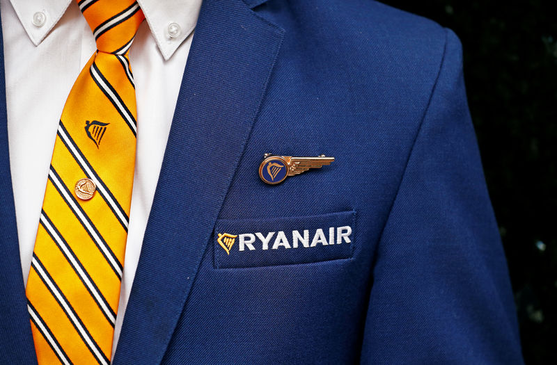 © Reuters. A Ryanair cabin crew member poses ahead of a news conference by Ryanair union representatives in Brussels