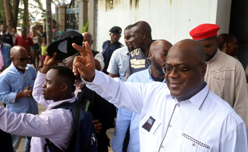 © Reuters. FILE PHOTO: Felix Tshisekedi, leader of the Congolese main opposition party, the Union for Democracy and Social Progress (UDPS), and a presidential candidate, leaves after casting his ballot at a polling station in Kinshasa