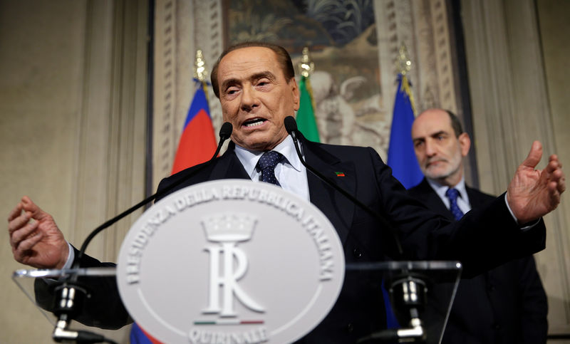 © Reuters. FILE PHOTO - Forza Italia leader Berlusconi speaks following a talk with Italian President Sergio Mattarella at the Quirinale palace in Rome