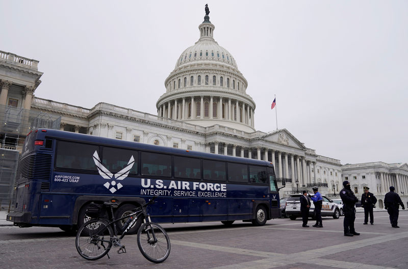© Reuters. Air Force bus meant to transport Speaker of the House Pelosi and other members of Congress to flight to Afghanistan sits in front of Capitol in Washington