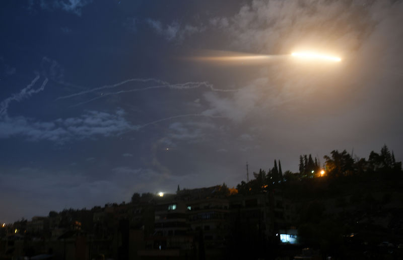© Reuters. Missile fire is seen over Damascus