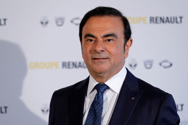 © Reuters. FILE PHOTO:  Carlos Ghosn, Chairman and CEO of the Renault-Nissan Alliance, poses after the Renault's 2015 annual results presentation at their headquarters in Boulogne-Billancourt