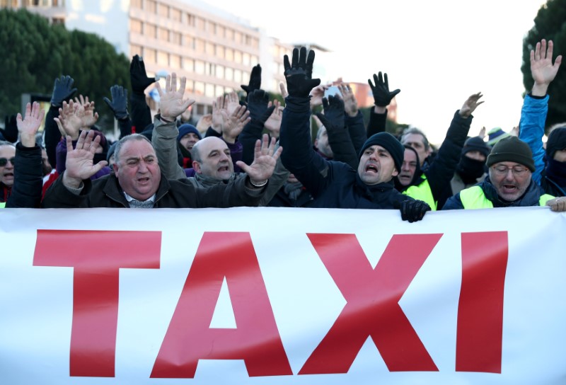 Image result for Madrid taxis block access to tourist fair in anti-Uber protests