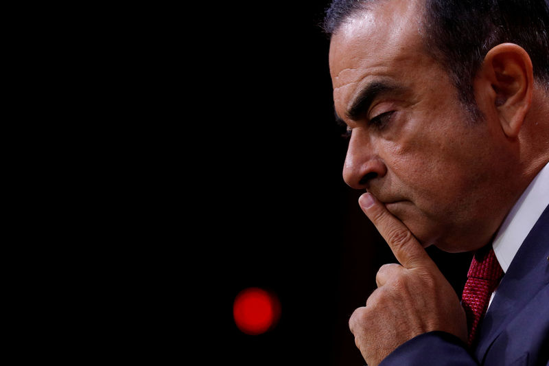 © Reuters. FILE PHOTO: Ghosn, Chairman and CEO of the Renault-Nissan Alliance, reacts during news conference in Paris