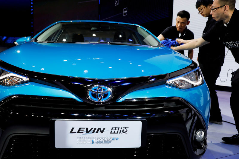 © Reuters. FILE PHOTO: A Toyota Levin plug-in hybrid vehicle is displayed during a media preview of the Auto China 2018 motor show in Beijing