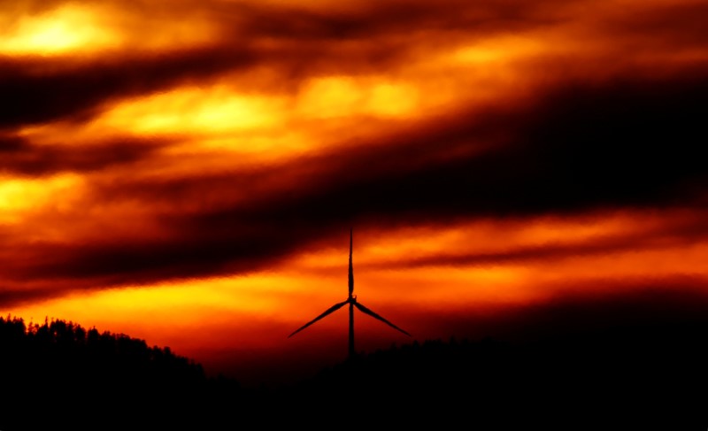 © Reuters. FILE PHOTO: A power-generating wind turbine is seen during sunset at a wind park near Saales