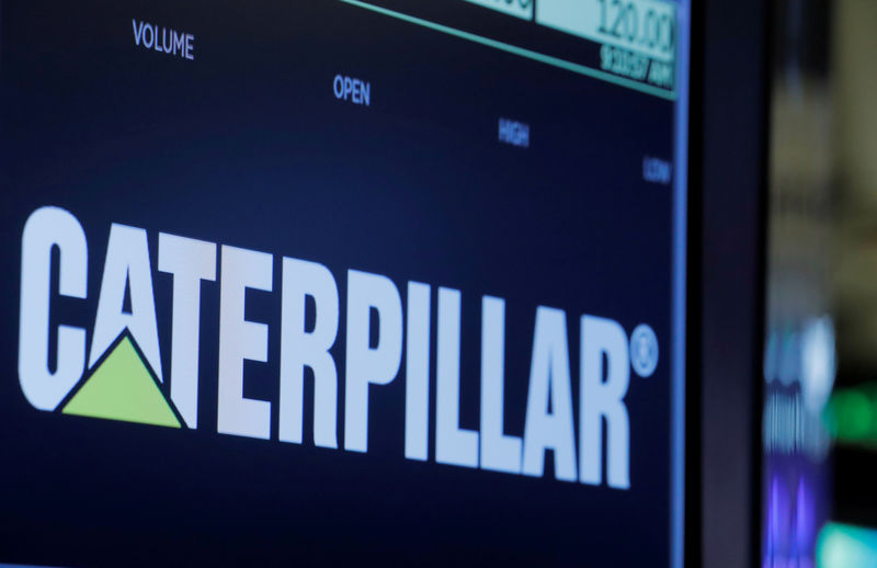 © Reuters. FILE PHOTO: The logo of Caterpillar is displayed on a screen on the floor of the New York Stock Exchange (NYSE) in New York