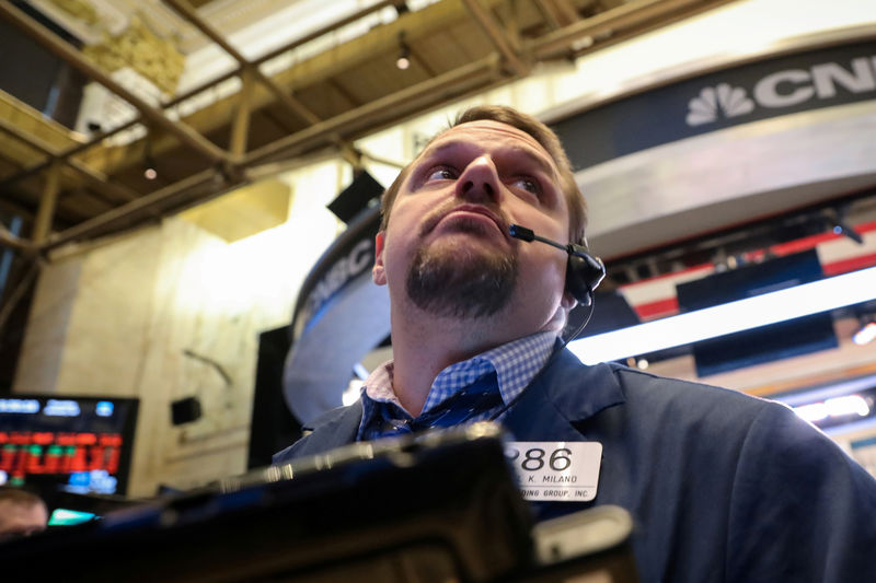 © Reuters. FILE PHOTO: A trader works on the floor of the NYSE in New York