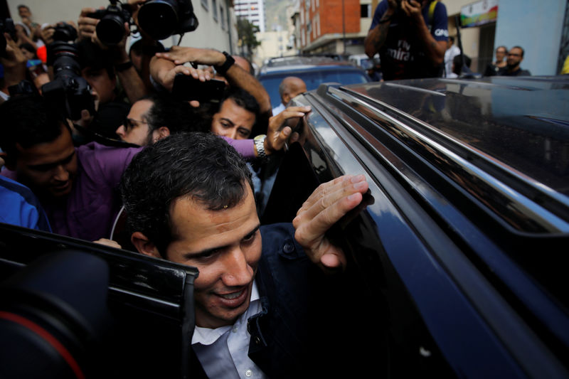 © Reuters. Venezuelan opposition leader and self-proclaimed interim president Juan Guaido leaves after attending a Mass at a local church in Caracas