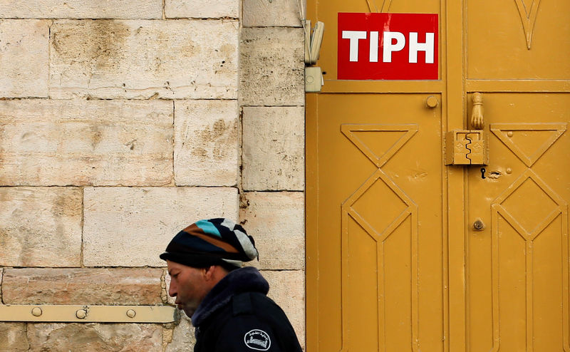 © Reuters. Sign of TIPH is seen on its office in Hebron, in the Israeli-occupied West Bank