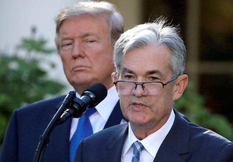 © Reuters. FILE PHOTO: FILE PHOTO: FILE PHOTO: U.S. President Donald Trump looks on as Jerome Powell, his nominee to become chairman of the U.S. Federal Reserve, speaks at the White House in Washington