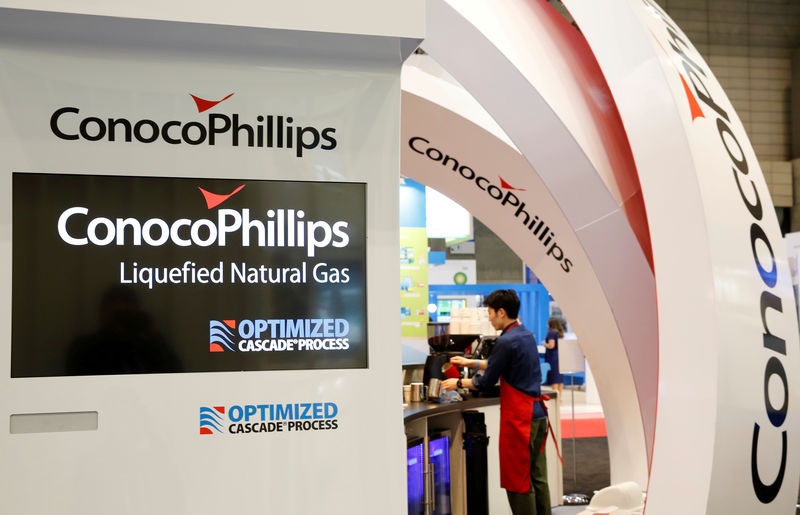 © Reuters. FILE PHOTO - Logos of ConocoPhillips are seen in its booth at Gastech, the world's biggest expo for the gas industry, in Chiba