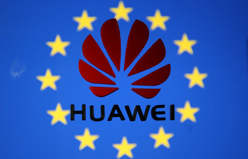 © Reuters. A 3D printed Huawei logo is placed on glass above displayed EU flag in this illustration taken