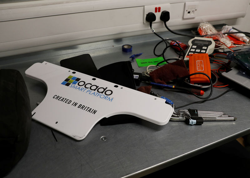 © Reuters. FILE PHOTO:  A technician's work area is seen at the Ocado CFC (Customer Fulfilment Centre) in Andover