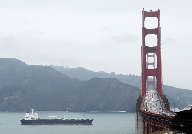 © Reuters. FILE PHOTO: An oil tanker passes underneath the Golden Gate Bridge during a rainfall in San Francisco