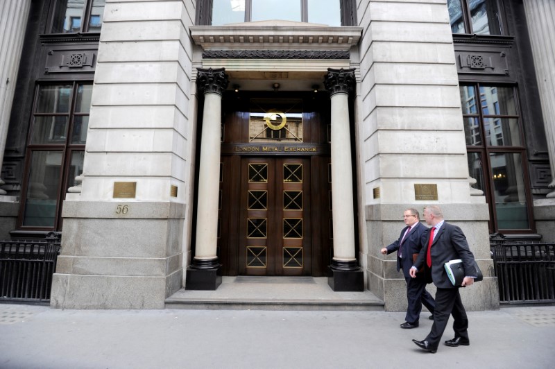 © Reuters. File photo of men walking past the London Metal Exchange (LME) in London