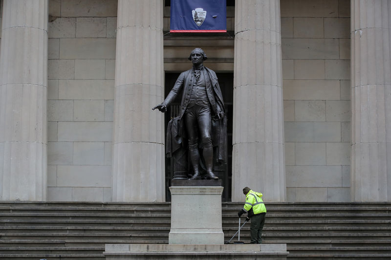 © Reuters. A National Park Service worker cleans debris at the Federal Hall National Memorial in New York