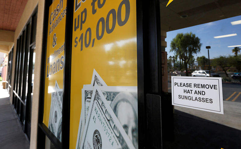 © Reuters. FILE PHOTO: The storefront of an Advance America loan store is shown in Palm Springs, California