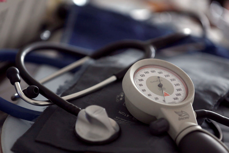 © Reuters. FILE PHOTO: A photo illustration shows a stethoscope and  blood-pressure machine of a French general practitioner displayed in a doctor's office in Bordeaux