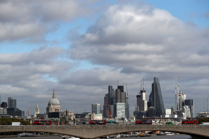 © Reuters. FILE PHOTO: Buildings in the City of London are seen behind Waterloo Bridge in London