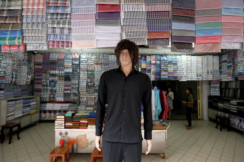 © Reuters. A garment shop is displayed along a street in Phnom Penh