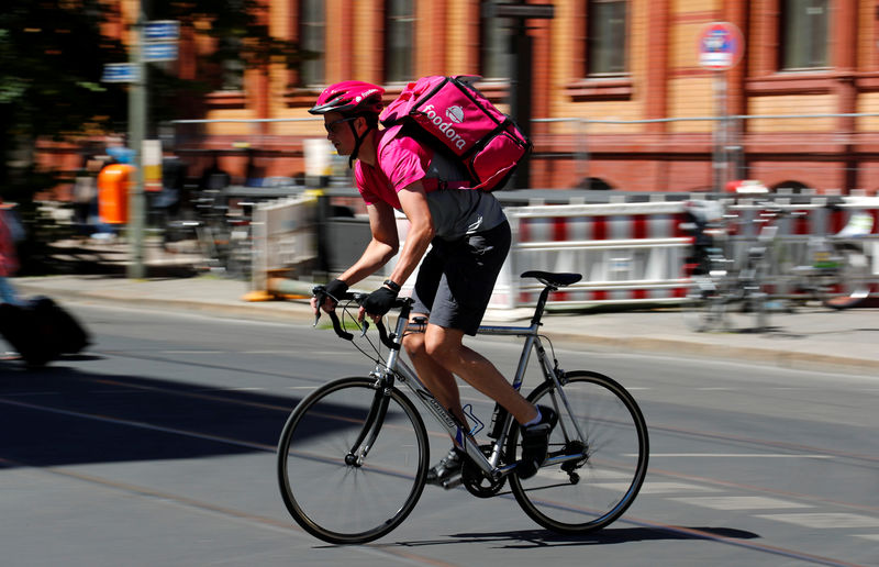 © Reuters. A Foodora delivery cyclist poses on a street in Berlin