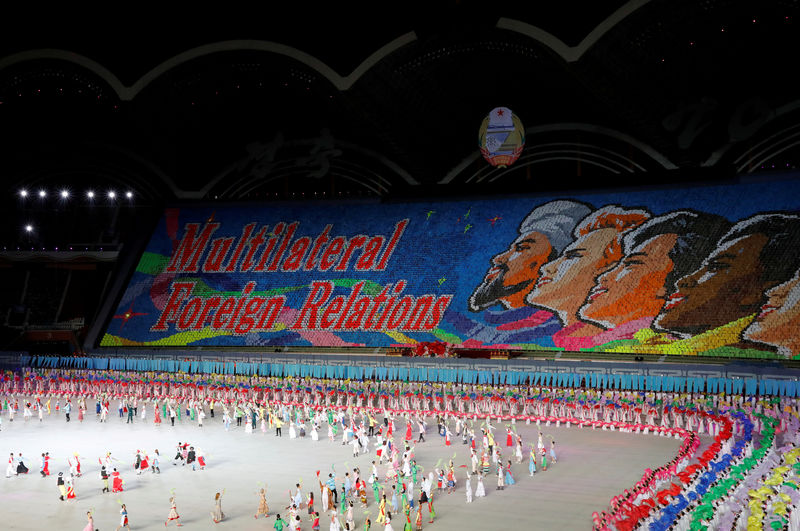 © Reuters. FILE PHOTO: Participants form a message during Mass Games in May Day stadium marking the 70th anniversary of North Korea's foundation in Pyongyang
