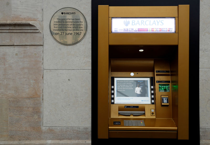 © Reuters. FILE PHOTO: A gold coloured ATM is seen as it commemorates the location of the world's first cash machine in London