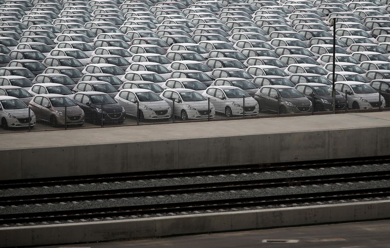 © Reuters. FILE PHOTO:  Vehicles are parked at a cargo terminal at Piraeus port, near Athens