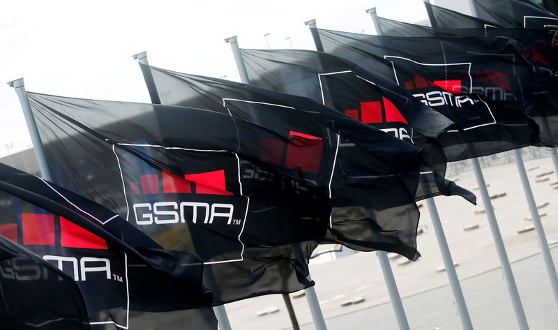 © Reuters. FILE PHOTO: GSMA flags fly at the Mobile World Congress in Barcelona
