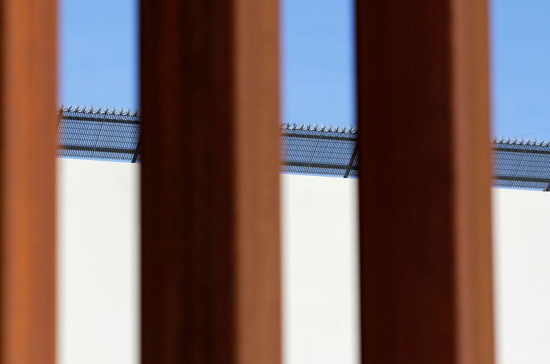 © Reuters. FILE PHOTO: A prototype for U.S. President Donald Trump's border wall is seen through the border fence between Mexico and the United States, in Tijuana