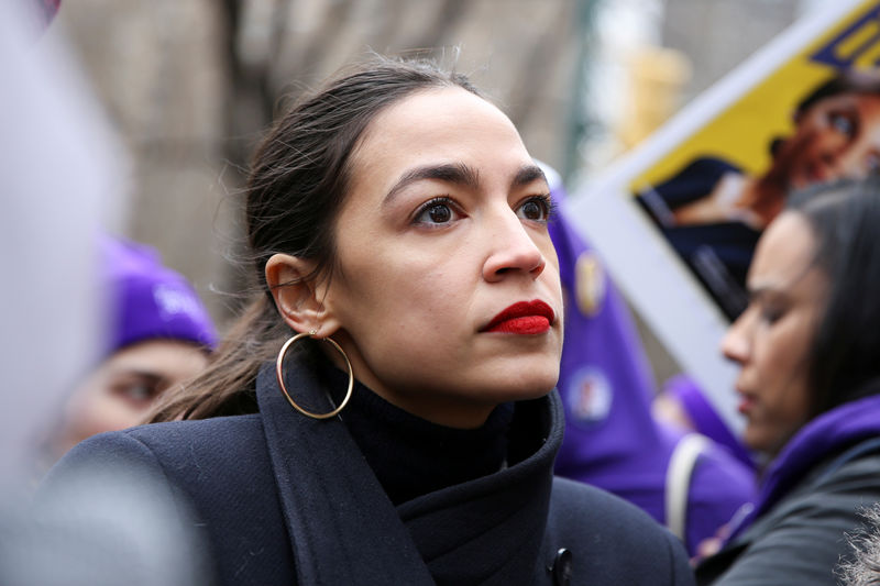 © Reuters. FILE PHOTO: Rep. Alexandria Ocasio-Cortez looks on during a march organised by the Women's March Alliance in the Manhattan borough of New York City