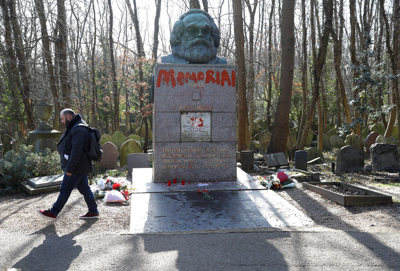 © Reuters. The Tomb of Karl Marx is seen daubed in red paint in Highgate Cemetery in London
