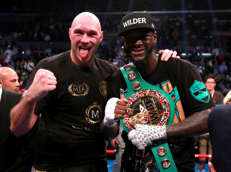 © Reuters. FILE PHOTO: Tyson Fury and Deontay Wilder after their fight at Staples Centre, Los Angeles, United States - December 1, 2018