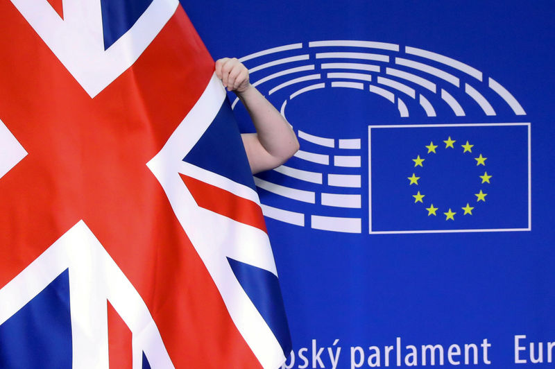 © Reuters. FILE PHOTO: The Union Jack flag is adjusted before a meeting between British Prime Minister Theresa May and European Parliament President Antonio Tajani at the EU parliament headquarters in Brussels, Belgium February 7, 2019.