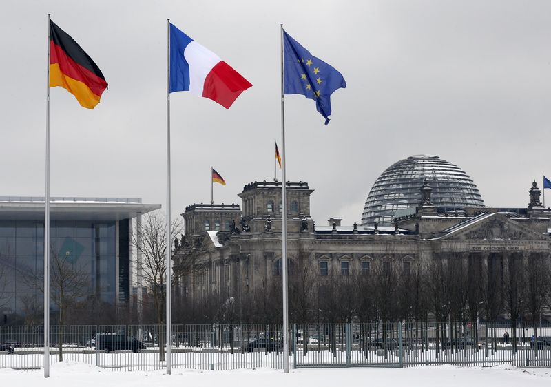 © Reuters. German French and EU flags flutter over the German lower house of parliament in Berlin