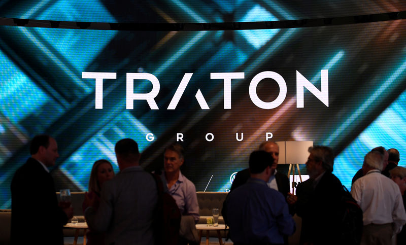 © Reuters. Visitors stand at booth of VW's truck unit Traton Group in Hanover